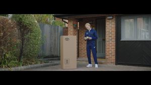 Jonnie Peacock receives a Toyota Human Support Robot in a shot from new short film