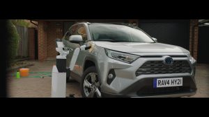 Toyota Human Support Robot cleans a RAV4 in a shot from new short film