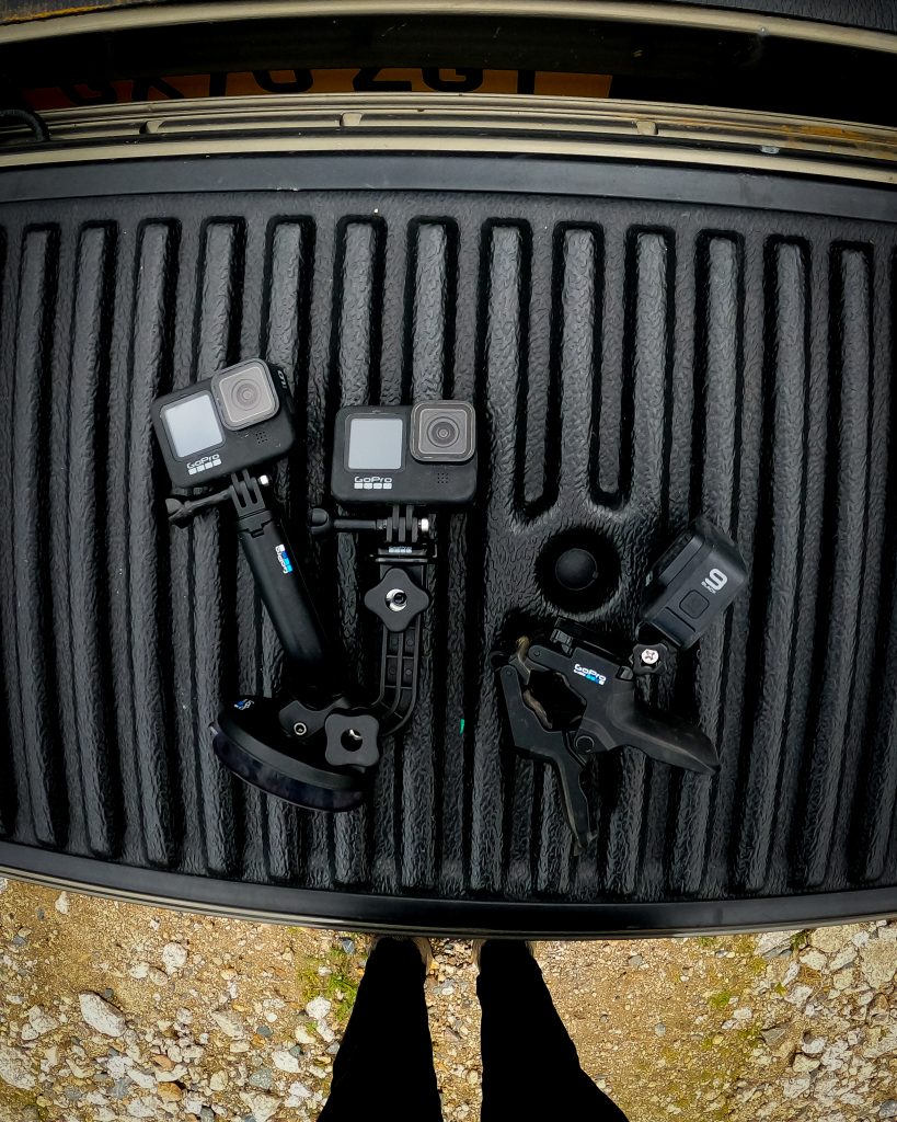 Selection of GoPro cameras and mounts on flatbed of Toyota Hilux Invincible