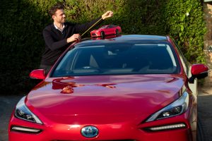 Alistair Brebner from Tamiya UK measures-up his company’s model Mirai against Toyota’s full-sized hydrogen-fuelled car.