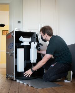 The Toyota HSR arrives at Anthony Walsh's house with Viktor Schmuck, a robotics PhD student from King's College London