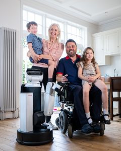 The Walsh family with the Toyota HSR robot