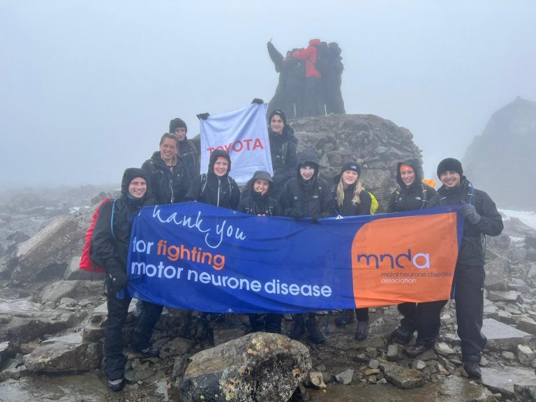 Toyota placement student at the end of their Three Peaks Challenge to raise money for the MND Association, on Mount Snowdon