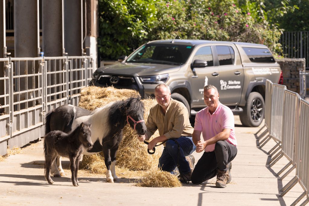Rob and Dave (pink shirt) Nicholson with Shetlands, seven-year-old Pony M and her ten-day-old foal Harriot, at Cannon Hall Farm, South Yorkshire.