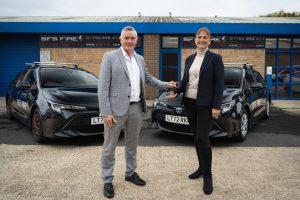 Neil Glasson, Group Fleet Business Centre Manager Currie Motors, hands the keys to Tanya Smyth, SFS Managing Director.