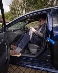 John using a dressing gown cord as a leg lifter