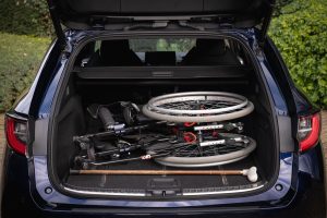 A wheelchair and walking stick in the boot of a Corolla Touring Sports