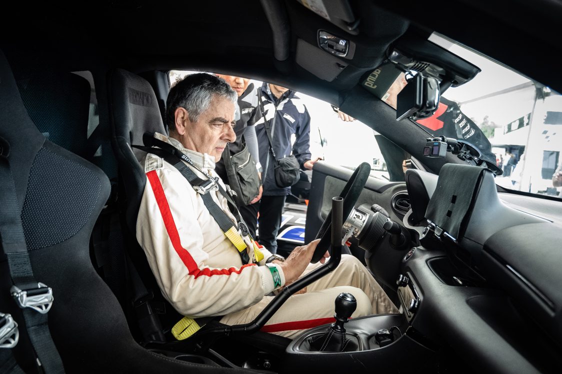 Rowan Atkinson at the wheel of the hydrogen-powered Toyota GR Yaris H2 Concept at the 2023 Goodwood Festival of Speed.