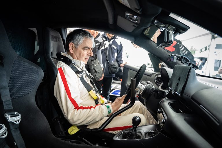 Rowan Atkinson at the wheel of the hydrogen-powered Toyota GR Yaris H2 Concept at the 2023 Goodwood Festival of Speed.
