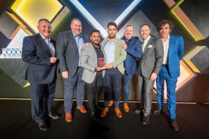 Ichiban Award winner (Medium) – Vantage Toyota York. From L to R: Mark Roden, Mark Roden, Toyota (GB) Operations Director, with the Vantage Toyota York team - Dale Baker, Dipash Chauhan, Nashaat Ahmed, Glen Ramskill, plus Scott Thompson, President and Managing Director of Toyota (GB) PLC, and Stephen Mangan, who presented the 2023 Toyota BRIT awards.