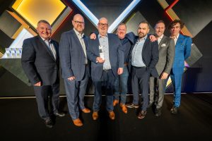 Retailer of the Year – Vantage Toyota Scarborough. From L to R: Mark Roden, Toyota (GB) Operations Director, with the Vantage Toyota Scarborough team - David Blease, Peter Stableford, Glen Ramskill, Andrew Parker, plus Scott Thompson, President and Managing Director of Toyota (GB) PLC, and Stephen Mangan, who presented the 2023 Toyota BRIT awards.