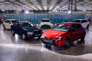 From L to R in foreground: Toyota Carina E from 1992, Toyota Corolla GS hatchback hybrid from 2024. www.rkpphotography.co.uk.