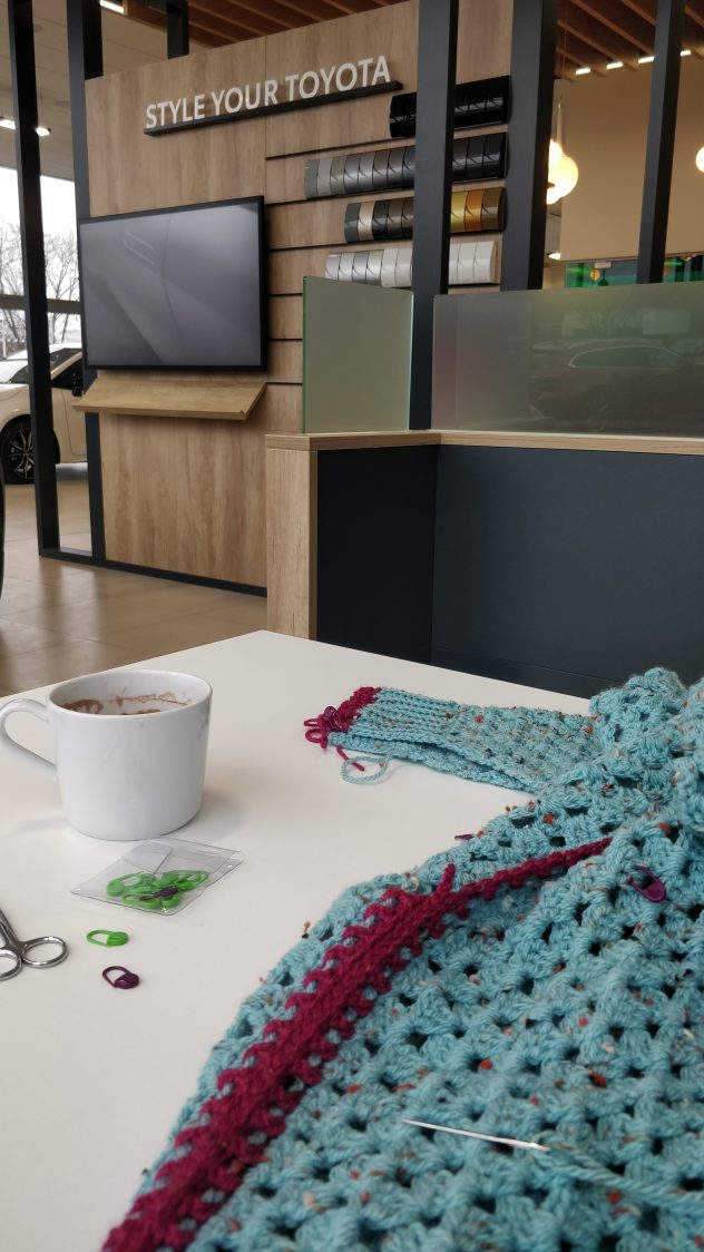 Karen Corradi's crocheting and complimentary drink at Steven Eagell Toyota Oxford.