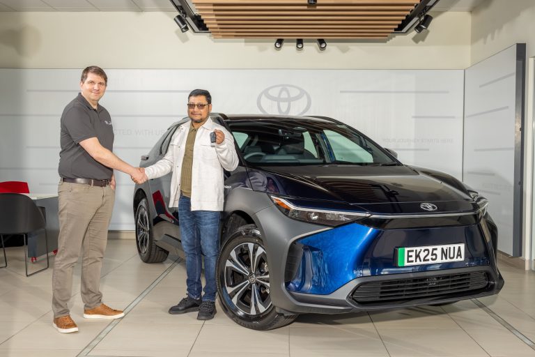 Paul Thomas, Area Manager One Toyota Business Team hands over the keys to a bZ4X to Nuruzzaman Chowdhury