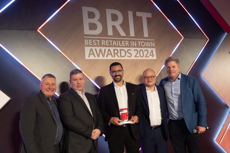From L to R: Mark Roden, Toyota (GB) Operations Director, with winners of the Toyota Ichiban award (Medium Centre), RRG Bury - Tony Pringle, Sales Manager, Anthony Rubio, General Manager, Andy Yip, Transaction Manager, and TV presenter Mark Durdan-Smith