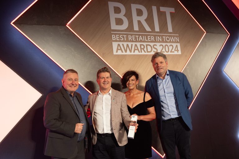 From L to R: Mark Roden, Toyota (GB) Operations Director, with winners of the Toyota Group of the Year award, FRF Group - Tim Horsley, After Sales Manager, Allison Dixon- Jenkins, Group Business Centre Manager, and TV presenter, Mark Durdan-Smith